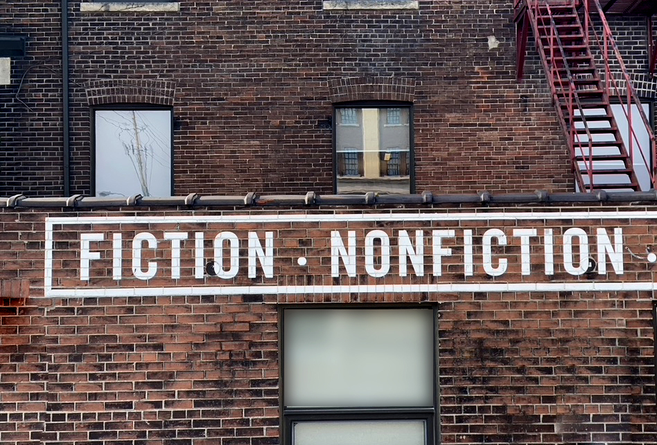 Ficton and Nonfiction painted on a brick wall